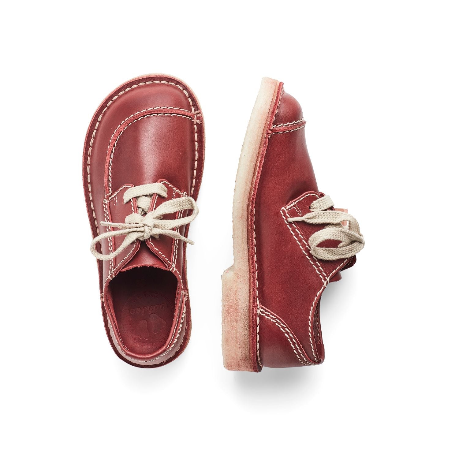 Duckfeet Fyn Granate moc-toe leather derby shoe, top and inner side view on white background